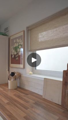 a white refrigerator freezer sitting on top of a wooden counter next to a window