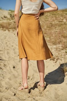 "We prefer our skirts sweeping in the air. Knee-length button front linen skirt. FABRIC: 100% softened Lithuanian linen COLOR: Please choose the desired color from the side menu. STYLE: Midi length linen skirt with buttons. SIZE CHART: 2 US/ 6 AU/ 34 EU: Bust 31.5\" (80 cm) , Waist 23\" (59 cm), Hips 35\" (88 cm) 4 US/ 8 AU/ 36 EU: Bust 33\" (84 cm) , Waist 25\" (63,5 cm), Hips 36\" (92 cm) 6 US/ 10 AU/ 38 EU: Bust 35\" (88 cm) , Waist 26,5\" (67,5 cm), Hips 38\" (96 cm) 8 US/ 12 AU/ 40 EU: Bust Linen Midi Skirt With Lining, Beach Linen Flared Skirt, Summer Knee-length Linen Skirt, Lined Linen Wrap Skirt For Summer, Summer Linen Wrap Skirt With Lining, Lined Linen Flared Skirt, Linen Flared Skirt With Lining, Linen Flared Skirt With Lined Detail, Flared Linen Skirt With Lining