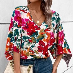 Chic Multicolor V-neck Shirt, Red Printed V-neck Shirt, Trendy Floral Print V-neck Tops, Trendy Floral Print V-neck Blouse, Trendy V-neck Blouse With Floral Print, Trendy V-neck Floral Print Shirt, Trendy V-neck Shirt With Floral Print, V-neck Printed Tops For Brunch, Printed V-neck Top For Brunch