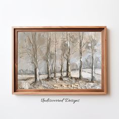 a painting is hanging on the wall in front of a white wall with a wooden frame