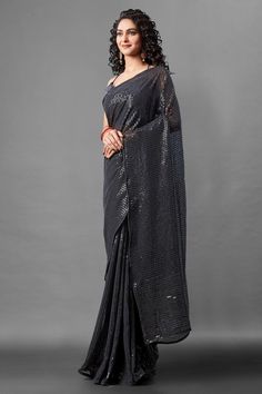 Attrective Look This Pretty Elegant Looking Designer Party Wear Saree In Black Color Paired With Blouse. This Saree Are Georgette And Blouse Are Banglori Silk Based With Designer Sequence Embroidery Work Beautified Saree. Buy Now.Product Features:  Saree Color: Black Blouse Color: Black Saree Fabric: Georgette Blouse Fabric: Banglori Silk Style Name: Designer Work: Sequence Embroidery, Piping Border Occasion: Partywear Size: Saree Length:-5.5 M Blouse Length:-0.80 M Wash Care: Dry Clean Disclaim Festive Party Wear Pre-draped Embroidered Saree, Festive Blouse Piece With Sequins And Traditional Drape, Floor-length Pre-draped Saree With Self Design For Party, Festive Sequined Blouse Piece With Traditional Drape, Traditional Pre-draped Saree For Festive Party, Evening Georgette Sequin Fabric With Traditional Drape, Celebration Pre-draped Saree With Sequins In Traditional Drape, Evening Semi-stitched Traditional Wear For Navratri, Embroidered Saree For Navratri Evening