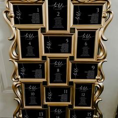 a gold framed wedding seating chart with black numbers