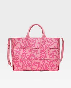 Make a bold statement with the Pink Graffiti Tote Bag, a playful and eye-catching accessory that's perfect for adding a pop of color to any outfit. This stylish tote features a vibrant pink color and a striking graffiti print, adding a touch of urban edge to any ensemble. The woven construction and double handles provide both style and functionality, while the spacious interior offers plenty of room for your essentials. Luxury Pink Tote Baguette Bag, Luxury Pink Bucket Tote Bag, Luxury Pink Tote Flap Bag, Hot Pink Shopping Bags, Luxury Pink Tote Box Bag, Cheap Pink Bags With Letter Print, Pink Wallpaper Shopping Bag, Pink Square Tote Bag, Luxury Pink Canvas Shoulder Bag