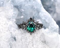 a green ring sitting on top of a pile of ice