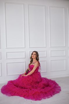 This hot pink princess dress will make you feel like you stepped straight out of a fairy tale. With its floor length and voluminous design,  it's perfect for any romantic occasion, from weddings to proms.  The small velvet belt and bow ties add unique and beautiful touches,  making you look and feel majestic.  (No awkward pumpkin coach rides here.) Message me for any kind of customizations. Pink Princess Ball Gown For Quinceanera, Floor-length Tulle Quinceanera Dress For Gala, Princess Style Quinceanera Dress With Ruffles For Party, Princess Tulle Quinceanera Dress For Gala, Pink Tulle Quinceanera Dress For Gala, Organza Princess Dress With Ruffles For Prom, Glamorous Ruffled Ball Gown For Debutante Ball, Ruffled Princess Dress For Wedding And Prom Season, Pink Princess Dress For Quinceanera