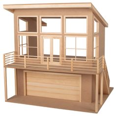 a wooden dollhouse with a balcony and balconies on the second floor is shown