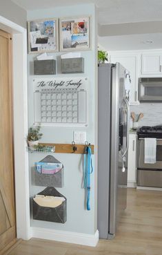 a refrigerator with magnets and pictures on the wall next to it in a kitchen