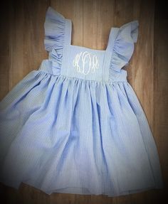 Seersucker Ruffled Kate Dress With Monogram for Girls and - Etsy Gingham Dress With Ruffled Straps And Ruffles, Gingham Dress With Ruffled Straps And Details, Gingham Ruffle Dress For Daywear, Gingham Ruffled Dress For Daywear, Gingham Dress With Ruffles For Daywear, Preppy Blue Ruffled Dresses, Preppy Blue Dresses With Ruffles, Preppy Striped Cotton Dress, Fitted Sleeveless Seersucker Dress