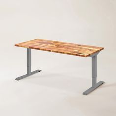 a wooden table with metal legs on a white background