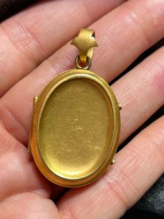 ". This beautiful oval locket has that gorgeous Victorian \"bloom\" to the gold that cannot be duplicated. It really can't be duplicated because the process has been illegal for almost 100 years now. The bale is an abstract fleur de lis shape. This locket is plated in 18k, thick enough to test 18k on the electronic tester! This locket does not have removable photo rings, but a printed picture could be carefully pressed in so it sits under the edge. I just print from my home printer on photo pape Yellow Gold Oval Locket Jewelry, Oval Yellow Gold Locket Jewelry, Yellow Gold Oval Locket Necklace, Oval Gold Jewelry Hallmarked, Oval Gold Hallmarked Jewelry, Oval Hallmarked Gold Jewelry, Antique Oval Jewelry With Polished Finish, Oval 14k Gold Locket Necklace, Classic Gold Oval Locket Necklace