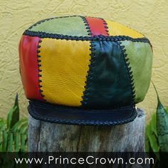 Size LARGE / Height 6 inches Rim 56 cm or 22 inches (to go over your head) Rasta Leather Hat made from variations of Red Gold Green and Blue leather. GENUINE LEATHER RASTA CROWN Prince Crown Hand Crafted Rasta Hat made from Genuine Designer Leather ☼ Hand Crafted and Hand Stitched ☼ 100% Leather exterior and lacing ☼ Stylish and useful, versatile and comfortable. ☼ Product of Jamaica, made in Jamaica by Jamaicans Pick one to fit your personality, your wardrobe... or gift one to someone special a Handmade Artisan Leather Hat, Artisan Handmade Leather Hat, Handmade Leather Brimmed Hat, Handmade Vintage Leather Hat, Vintage Handmade Leather Hat, Retro Leather Cap, Handmade Leather Hat With Flat Brim, Artisan Leather Brimmed Hats, Rasta Hat