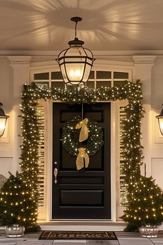 a front door decorated with christmas lights and wreaths