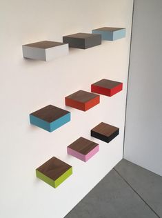 several different colored blocks on the wall next to each other