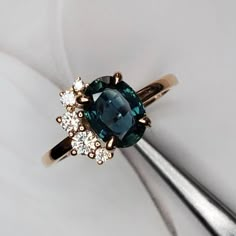 a ring with a blue diamond surrounded by white diamonds