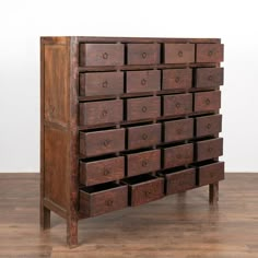 an old wooden dresser with many drawers