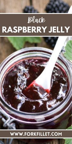 black raspberry jelly in a jar with a spoon