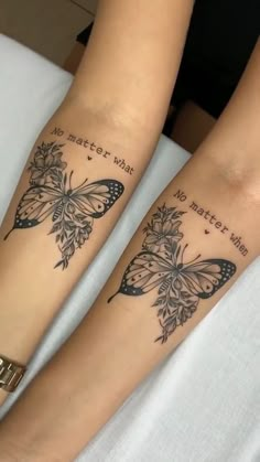 two girls with matching tattoos on their arms, one has a butterfly and the other has a flower