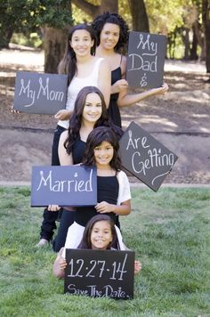 a group of women holding up signs that say they are married