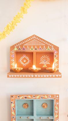 two wooden shelves with candles on top of them