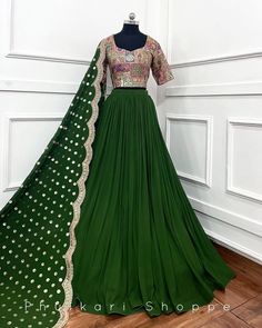 Made to Order/Measurement/Custom Order Lehenga - Color : green - Fabric : Georgette - Fully flared paneled lehenga - Embroidered  Blouse -  Net Dupatta with Gold Border - Drawstring closure with Tassels - - It can be customize in any design or size  PLEASE NOTE: BUYERS ARE RESPONSIBLE FOR ANY CUSTOMS AND IMPORT TAXES THAT MAY APPLY. This is a made to order product. If you opt for 'Made To Measurement Option', we will provide a measurement template and you can share the measurements likewise. If you want to opt for 'Standard Size', Please refer to the size chart provided in the listing. Shipping: Standard Shipping is done by DHL ecommerce and it mostly takes 2 to 3 weeks to deliver after dispatch. Express Shipping is done by DHL express and it mostly delivers within a week after dispatch. F Green Saree Set For Reception, Green Sharara For Reception And Navratri, Green Sets For Eid Reception, Green Sets For Reception And Eid, Designer Green Sharara With Intricate Embroidery, Green Semi-stitched Lehenga With Dupatta, Semi-stitched Green Lehenga With Dupatta, Green Semi-stitched Sharara With Traditional Drape, Designer Green Floor-length Traditional Wear