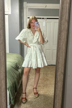 This Michelle Ruffle Mini Dress is perfect for trendy brides-to-be this spring! With its stylish design and lightweight fabric, you'll feel confident and elegant on your special day. Say yes to this must-have dress! Fits true to size. Taya is wearing a small and Tara is wearing a large.