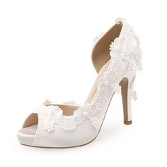 Step into summertime elegance with our collection of Women's White Wedding Shoes. Designed to complement the blissful ambiance of a summer wedding, these shoes blend sophistication with comfort. Crafted with premium materials, they ensure a perfect fit for your special day. Whether you prefer strappy sandals, chic pumps, or graceful flats, our selection offers a variety of styles to suit your taste. Radiate timeless charm as you walk down the aisle in our Women's White Wedding Shoes, the epitome Summer Open Toe Wedding Shoes, Fitted Summer Wedding Shoes With Open Toe, Fitted Open Toe Wedding Shoes For Summer, Synthetic Closed Toe Wedding Shoes, Summer Wedding Shoes Fitted, Fitted Summer Wedding Shoes, White Synthetic Round Toe Wedding Shoes, Wedding Sandals With Round Toe In Synthetic Material, Synthetic Heels For Summer Wedding