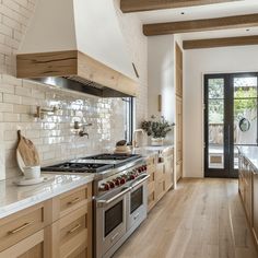 a kitchen with an oven, stove and counter tops in it's center island