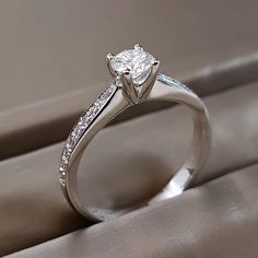 a white gold engagement ring with diamonds on it