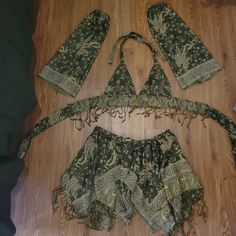 Best fits: - cup size: A-C - skirt: waist 27 - 36 inch (DM for other sizes) - shortest part of skirt: 8 inches long - longest part of skirt: 17 inches long This set includes: crop top, sleeves, hood, and fairy skirt Handmade by me <3 Made to Order, ready to ship in 3-5 weeks DM for other colors! If you're interested in a different style top or skirt, or want to add sleeves or a garter! #handmade #fae #festival #fairy #rave Pashima Scarf Rave, Mushroom Fairy Rave Outfit, Fitted Green Sets For Festival, Green Fitted Bohemian Set, Bohemian Fitted Party Sets, Fitted Bohemian Party Sets, Bohemian Halter Top For Party, Bohemian Halter Top For Beach Party, Fitted Bohemian Festival Clothing Set