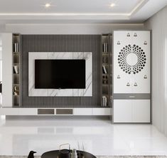 a modern living room with white walls and marble flooring, built - in entertainment center