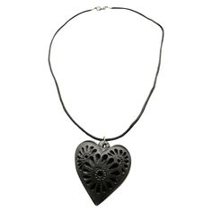 A heart-shaped charm adds strength to this beautiful necklace, this black clay jewel for women fits comfortably on all neck sizes. It is handcrafted with black clay by artists from Oaxaca, Mexico. This one-of-a-kind product is ready to make the ideal gift. It is an incredible surprise for any woman. Great gift for your mom or grandma on Mother's Day, anniversary, birthday, or wedding celebration. This delicate "Barro Negro" (black clay) piece is carefully handcrafted by artisans in San Bartolo C Black Bohemian Heart-shaped Jewelry, Black Heart-shaped Bohemian Jewelry, Black Heart Shaped Bohemian Jewelry, Artisan Carved Black Necklace, Bohemian Black Carved Necklace, Handmade Black Heart Pendant Necklace, Artisan Black Carved Necklace, Handmade Adjustable Black Heart Necklace, Black Bohemian Hand-tooled Jewelry