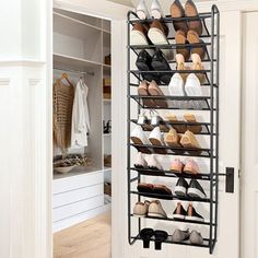 a shoe rack in a closet filled with shoes