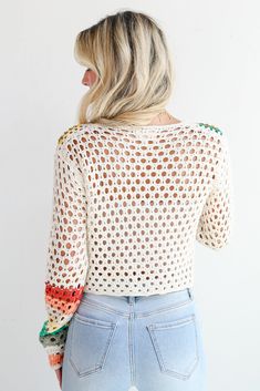 You'll be ready for dreamy days in the sun when you've got the Vibrant Crush Ivory Crochet Knit Top! This top features an array of bright, cheerful colors woven into an intricate crochet knit pattern, creating a unique, eye-catching design that adds texture and personality to any outfit. The button-front style offers versatility and ease of wear, allowing you to style it open over a tank or buttoned up for a more polished look. Crafted from soft, breathable yarn, this top provides comfort while Crochet Knit Top, Intricate Crochet, Casual Kimono, Brunch Dress, 4th Of July Outfits, Rust Dress, Puff Sleeve Dresses, Casual Jumpsuit, Knit Sweatshirt