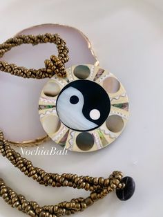 Abalone Yin Yang Necklace, Large Yin Yang necklace, Mother of Pearl pendant, Yin Yang jewelry, Boho round Necklace, Gift for her These eye-catching necklaces have a luminous color that really lights up your look The shells and the abalone are polished with High gloss and bonded with black resin on the backside for stability. ⭐️Material: Abalone Shell, Mother of Pearl, Beads Therefore, they may have slight variations Color and in appearance, pattern and color due to the nature of them. They have Symbolic White Jewelry For Festivals, Symbolic White Medallion Necklace, White Round Pendant Necklace For Festival, Spiritual Sun And Moon Design Round Pendant Necklace, Spiritual Sun And Moon Round Pendant Necklace, Handmade Symbolic White Necklace, Festival Sun And Moon Design Round Necklace, Symbolic Round Pendant Necklaces For Festival, Spiritual Necklaces With Sun And Moon Design For Festivals