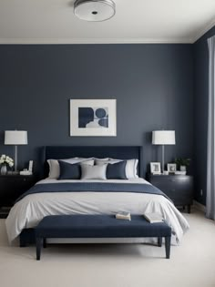 a bedroom with dark blue walls and white bedding in the center, along with two lamps on either side of the bed