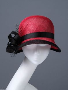 This small red hat was made for lovers of the style of the twenties of the last century. A deep head and a slight sloping brim are characteristic elements of these times. The wide trim perfectly marks the wavy shape of the brim, and the black ribbon and the bow on the right side complete the entire composition.  This headpiece is hand formed and sewed, making it an exclusive design. This artisan cocktail hat would perfectly compliment elegant outfit at a wedding or similar event. *Handmade item *Size: 57cm *Fabric : red black sinamay  *Ships worldwide from Poland *More products available on www.joremi.co.uk If you want to make minor changes or create your own design, I encourage you to do so. I am happy to create something especially for you.  All of my products are exclusively designed an Retro Mini Hats With Curved Brim, Vintage Red Summer Hat, Classic Red Top Hat With Flat Brim, Vintage Red Fedora With Curved Brim, Classic Red Fedora With Curved Brim, Classic Adjustable Cloche Mini Hat, Classic Red Hat With Curved Brim, Gatsby Style Adjustable Cloche Hat With Curved Brim, Red Retro Hat With Curved Brim