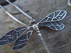 Dragonfly necklace...dragonfly is 2" wide by 1 1/2" tall, cast and antiqued in sterling silver  925.... great detail...the chain is 18" long also in sterling silver 925 Antique Silver Hand Forged Sterling Silver Necklaces, Hand Forged Sterling Silver Necklace In Antique Silver, Hand Forged Antique Silver Sterling Necklace, Elegant Sterling Silver Dragonfly Necklace, Antique Silver Sterling Silver Necklace With Large Pendant, Antique Silver Necklace With Large Sterling Silver Pendant, Handmade Silver Dragonfly Jewelry, Adjustable Sterling Silver Dragonfly Necklace, Nickel-free Sterling Silver Dragonfly Jewelry