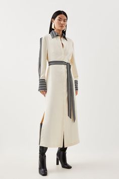 Balanced Proportions Are Spotlighted By This Midi Dress, Flowing Over The Silhouette With A Lightweight Twill Construction. Characterised By Striped Borders To The Long Batwing Sleeves, Self-Tie Belt, And Collared V-Neck Bodice, This Piece Pairs Best With Streamlined Stilettos For A Truly Polished Effect.Collared V-Neckbatwing Sleevesmidi Lengthself-Tie Belt Grey Shirt Dress Outfit, Business Formal Dresses, Oprah Winfrey Style, Cloth Belts, Cutwork Dress, Stripe Shirt Dress, Wardrobe Minimalist, Tie Sleeve Dress, Stripes Dress