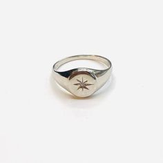 Description: Beautifully engraved starburst silver signet ring with a Cubic zirconia centre piece. Can easily be mixed with other jewellery fromOur celestial range. Material : 925 Sterling silver Comes gift wrappedMy jewellery is packaged in a sturdy gift box that protects it and makes it easily to store. Online store : www.raw-london.co.ukInstagram: @rawlondonjewelleryEmail me: sales@raw-london.co.ukDo not hesitate to contact me with any doubts, I am happy to help you!Metal: Silver Condition: N Silver Diamond Ring That Is Tarnish Resistant, Silver Tarnish Resistant Diamond Ring, Silver Tarnish Resistant Diamond Ring For Promise, Silver Tarnish-resistant Diamond Ring For Promise, Formal Silver Diamond Ring, Tarnish Resistant, Silver Tarnish-resistant Round Crystal Ring, Celestial Star Shaped Signet Promise Ring, Celestial Star-shaped Signet Promise Ring, Silver Diamond Engraved Signet Ring