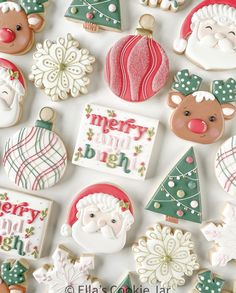 decorated christmas cookies arranged on top of each other in different shapes and sizes, including santa claus