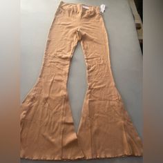 These Pants Are Super Cute. They Can Be Paired With A Crop Top, Tie, Top, Or Any Top Of Your Choice With Boots Or Heels. They Have One Small Defect On The Left Leg, A Small Circle Of A Lighter Shade. It’s Not Very Noticeable. See The Last Two Photos For More Detail. Questions? Ask! Want To Make An Offer? Make One! Thank You For Shopping! Be Sure To Look At The Rest Of My Closet To See If You Can Find Anything To Mix And Match Or Add An Accessory, A Pair Of Shoes To Go With These Adorable Pants! Stretch Brown Pants, Non-stretch High-waisted Beige Pants, Beige Stretch Long Pants, Casual Fitted Brown Bottoms, Spring Brown Flare Bottoms, High-waisted Beige Bottoms For Fall, High Waist Beige Bottoms For Fall, Beige Flare Cotton Bottoms, Beige Cotton Flare Bottoms