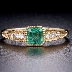 Elegant Gold Emerald Ring For Wedding, Elegant Gold Emerald Wedding Ring, Exquisite Gold Emerald Ring For Anniversary, Exquisite Gold Emerald Ring With Round Cut, Classic Gold Emerald Ring For Wedding, Gold Emerald Diamond Ring With Accents, Classic Emerald Ring With Diamond Accents For Wedding, Classic Gold Emerald Wedding Ring, Exquisite Emerald Ring With Diamond Accents For Wedding