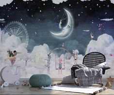 a room with a large wall mural in the shape of a night sky and various children's toys