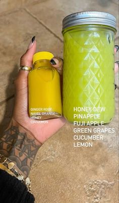 a woman holding a jar of green apple cucumber lemon flavored pineapple