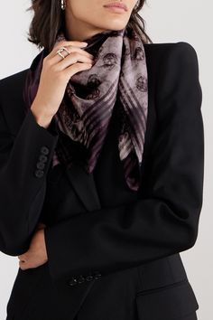 Alexander McQueen's scarf is printed with the label's signature skulls over an abstract shape that's reminiscent of a Rorschach inkblot. It's been made in Italy from silk-twill and works just as well draped around your neck as it does tied to the handle of an oversized tote.