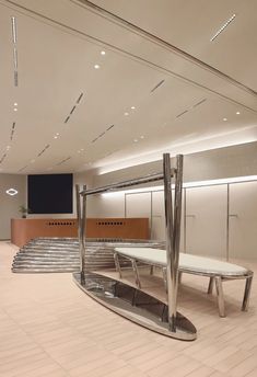 an empty waiting area with benches and stairs