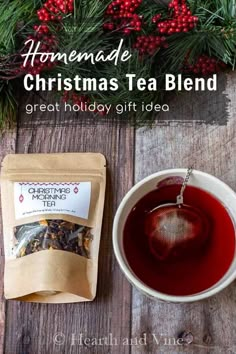 a cup of tea next to a bag of christmas tea