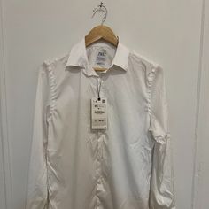 Zara White Button-Up Dress Shirt Brand New/Tags - Men's Medium Great Piece For All Wardrobes Brand New With Tags Easy And Reliable Shipping Fitted White Zara Shirt, White Slim Fit Dress Shirt With Button Closure, Classic Zara Button-up Shirt, Zara Classic Button-up Shirt, White Business Dress Shirt With Buttons, White Dress Shirt With Buttons For Business, White Dress Shirt For Business, Zara Classic Office Shirt, White Button-up Business Shirt