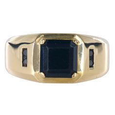 A true masterpiece of timeless elegance. Featuring a meticulously crafted 3.6mm shank and an eye-catching head size of 10.75mm, this ring is designed to adorn a size 9.75 finger with effortless style. At its heart lies a mesmerizing square-cut onyx, measuring 8x8mm, exuding an aura of mystery and allure. Accentuating its exquisite beauty are four round brilliant-cut black diamonds, each weighing 0.015 carats, adding a touch of glamour and refinement.  Shank size: 3.6mm Head size: 10.75mm Ring si Onyx Signet Ring, Real Gold Jewelry, Sell Gold, Black Diamonds, Square Cut, Color Dorado, Gold Filled Jewelry, Round Brilliant Cut Diamond, Signet Ring