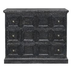 an old black wooden dresser with many drawers